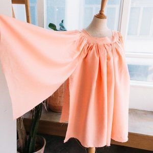 a pink top